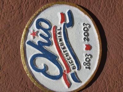 close up of logo on historical marker sign that says ohio bicentential 1803 2003